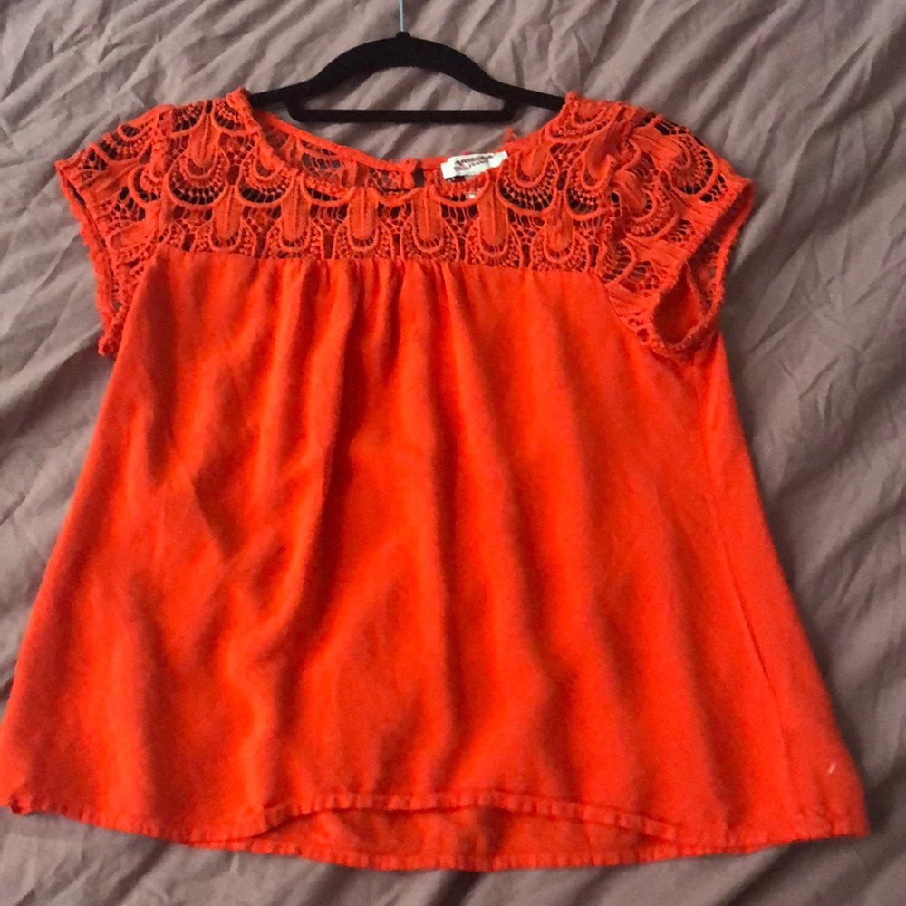 Red blouse with patterned neck